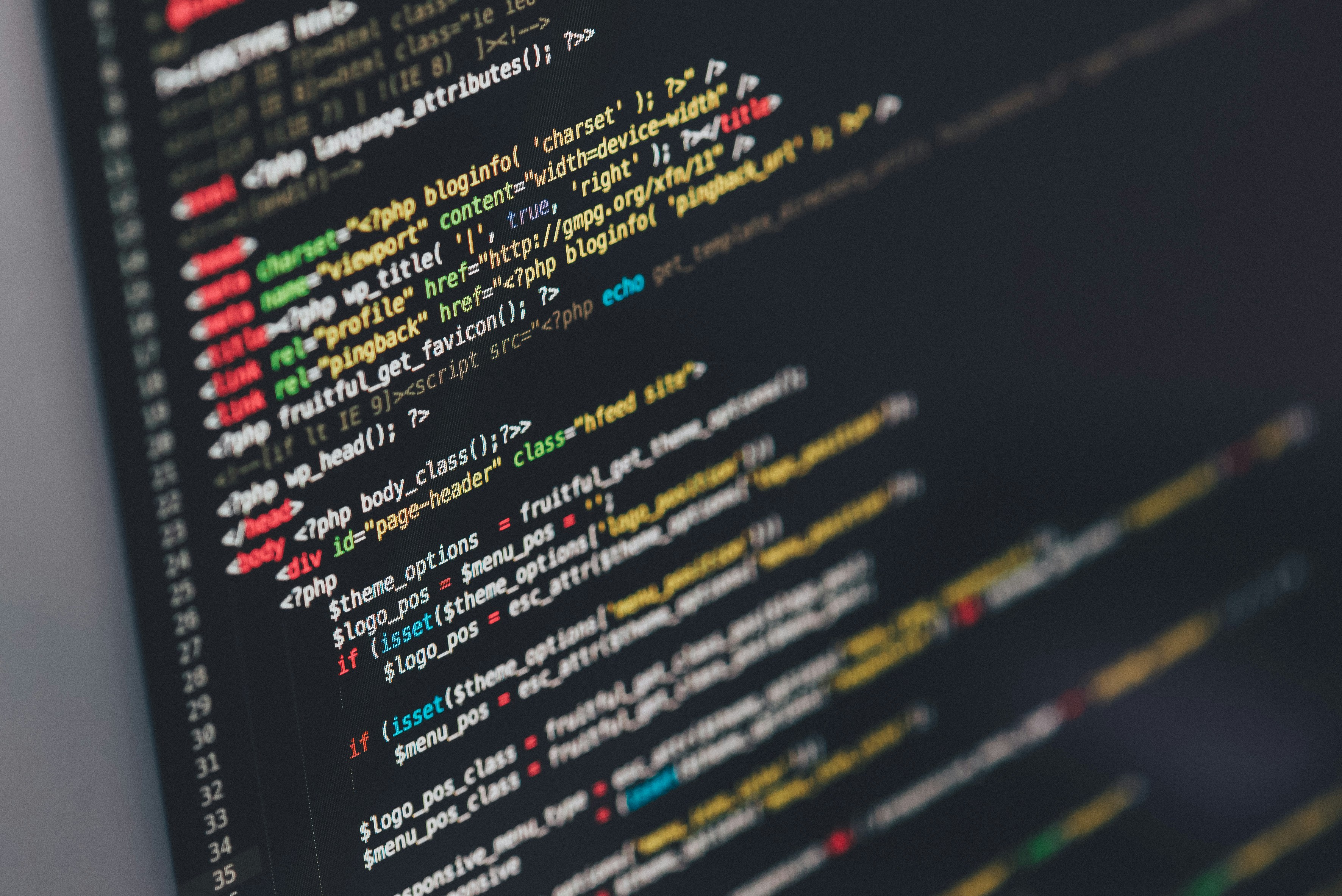 WordPress website planning on a laptop with design notes nearby